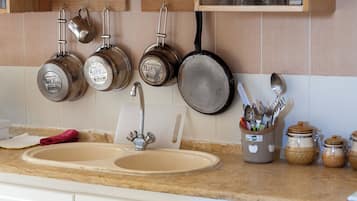 Apartment, Balcony, City View | Private kitchen | Fridge, stovetop, cookware/dishes/utensils