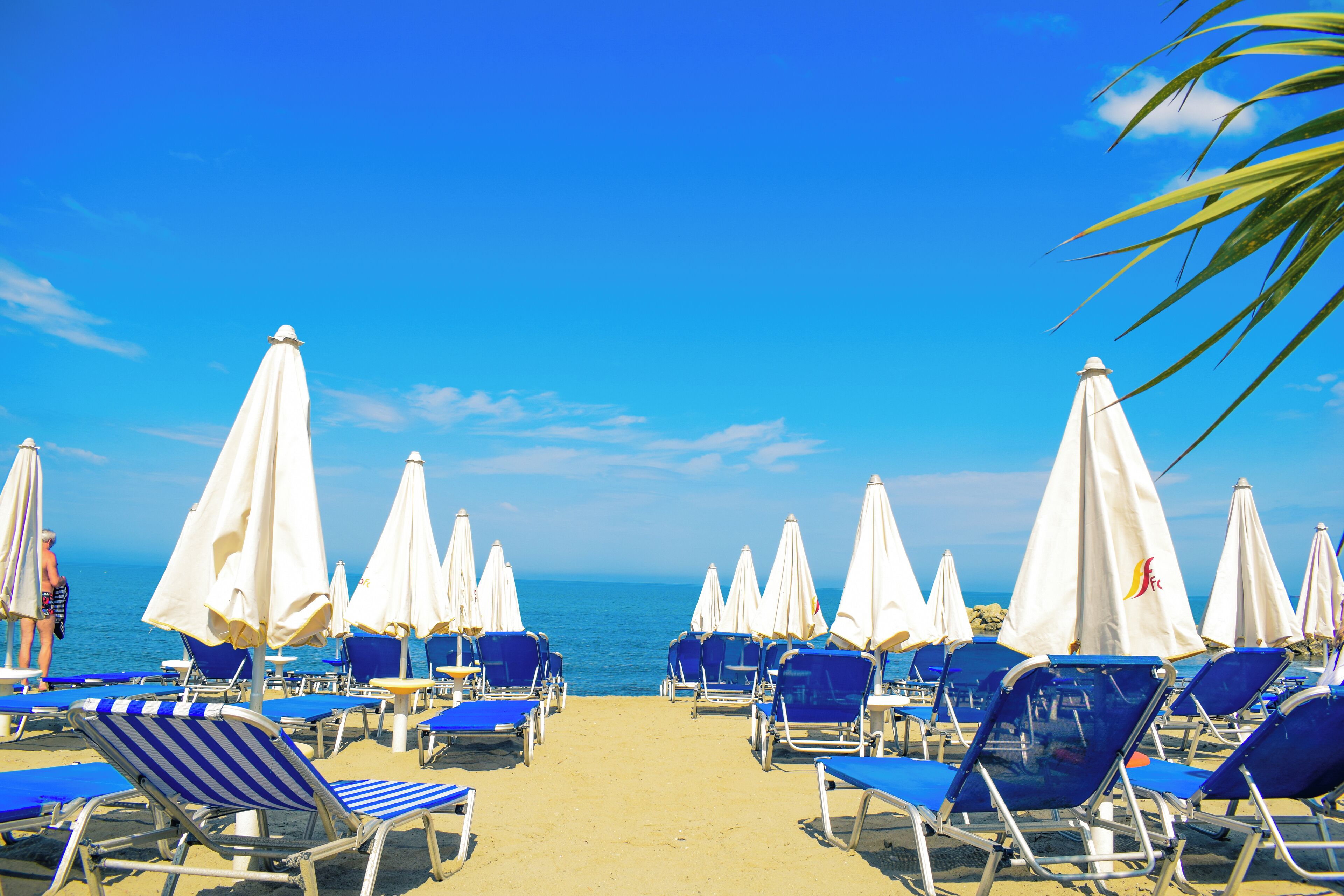 Platja privada, para-sols per a la platja i tovalloles de platja 