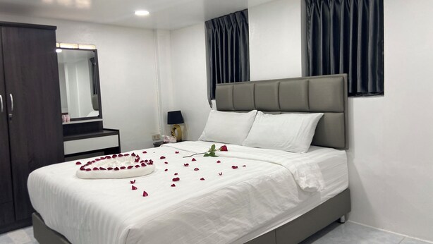 A modern bedroom with a large bed, a nightstand, a dresser, and a mirror. - Private Villa 5 min from Patong Beach,Center Patong,Jungceylon. Bangla Road Gate (Pa Tong)
