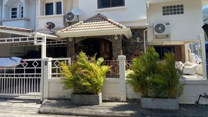 A two-story house with a tiled roof, satellite dishes, and a gated entrance. - Private Villa 5 min from Patong Beach,Center Patong,Jungceylon. Bangla Road Gate (Pa Tong)