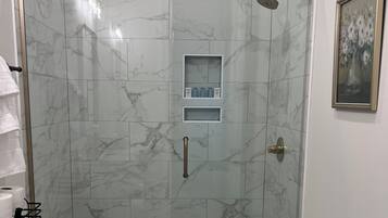 Shower, hair dryer, towels, soap