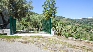 A gated entrance with a clear view of a hilly landscape in the background. - 2 bedroom stunning home in Perdifumo (Perdifumo)