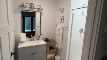 Shower, towels, soap, toilet paper