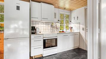 Fridge, stovetop, coffee/tea maker, cookware/dishes/utensils