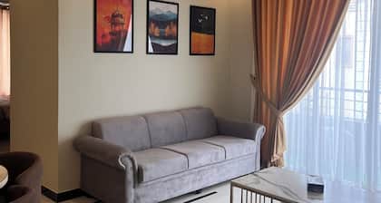 Cozy 2-bedroom condo in secured compound .