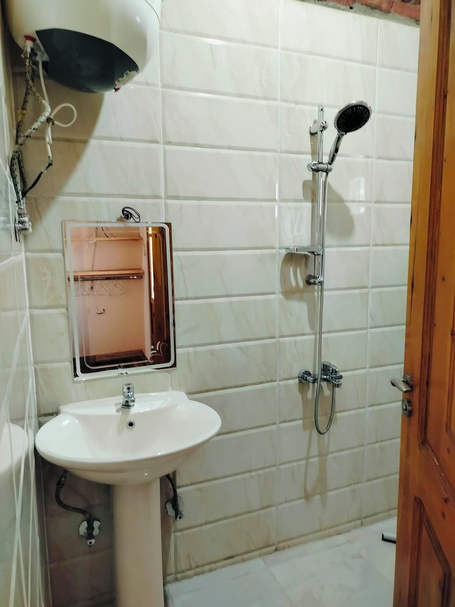 Shower, towels, soap, toilet paper