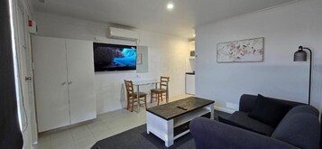 Junior Suite, Courtyard View | Living area | 40-inch Smart TV with digital channels