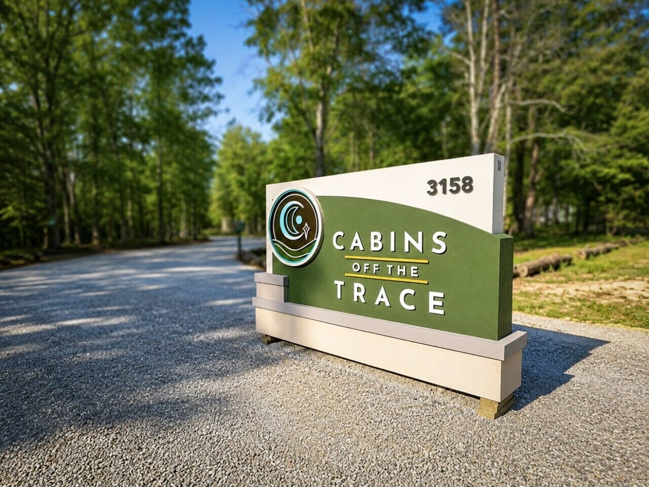 A sign for 'Cabins Off the Trace' with a cabin number 3158.