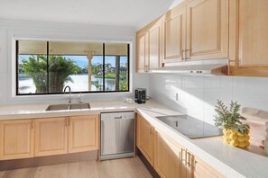 Microwave, oven, stovetop, dishwasher - Palm Springs Waterfront Retreat - Prime Gold Coast location (Broadbeach Waters)