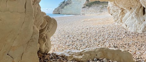 Beach nearby, black sand, sun loungers, beach umbrellas