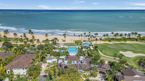 A coastal resort with a pool, golf course, and beach. - Modern Luxury in Tropical Paradise at Bahia Beach Resort within the Four Seasons (Río Grande)