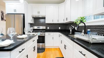 Fridge, microwave, stovetop, coffee/tea maker