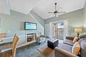 Comfort Condo, 1 Bedroom, Balcony, Beachside | Living room | 32-inch Smart TV with cable channels