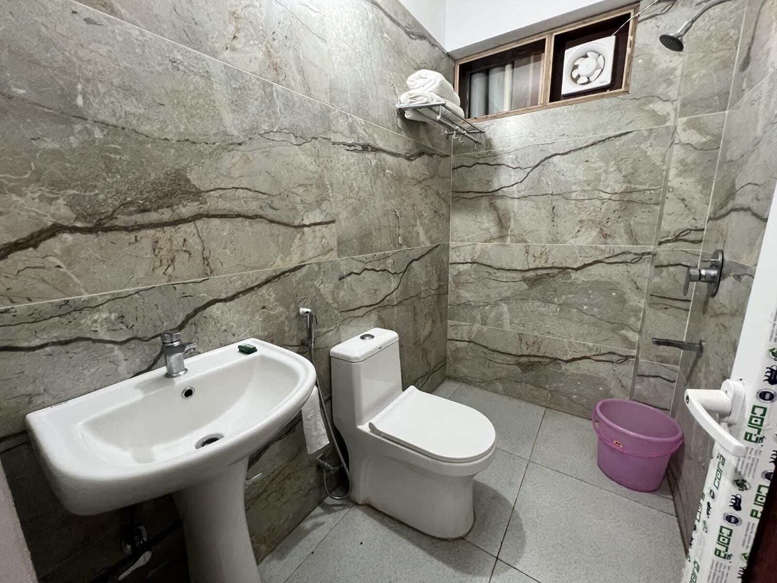 Signature Room | Bathroom | Shower, towels