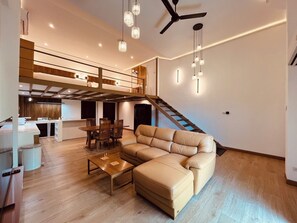 TV - Khaolak LOFT Suite B with 2 King size beds 1 bathroom at Kokotel Montana Hotel (Khuekkhak)