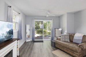 TV, fireplace - Modern Huntersville Oasis w Sauna, Fire Pit, Screened Patio & Fenced Yard For Pets! + 15% Off Stay! (Huntersville)