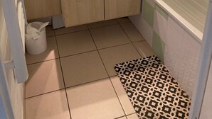 A bathroom with a sink, mirror, and shower. - apartment, balcony, view of nature, sleeps 6 (Ondres)