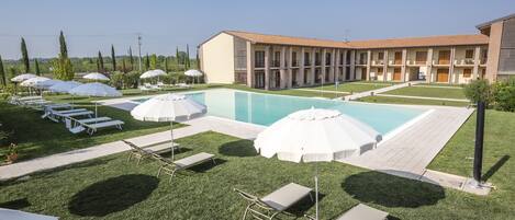 Seasonal outdoor pool, open 9:00 AM to 7:30 PM, pool umbrellas