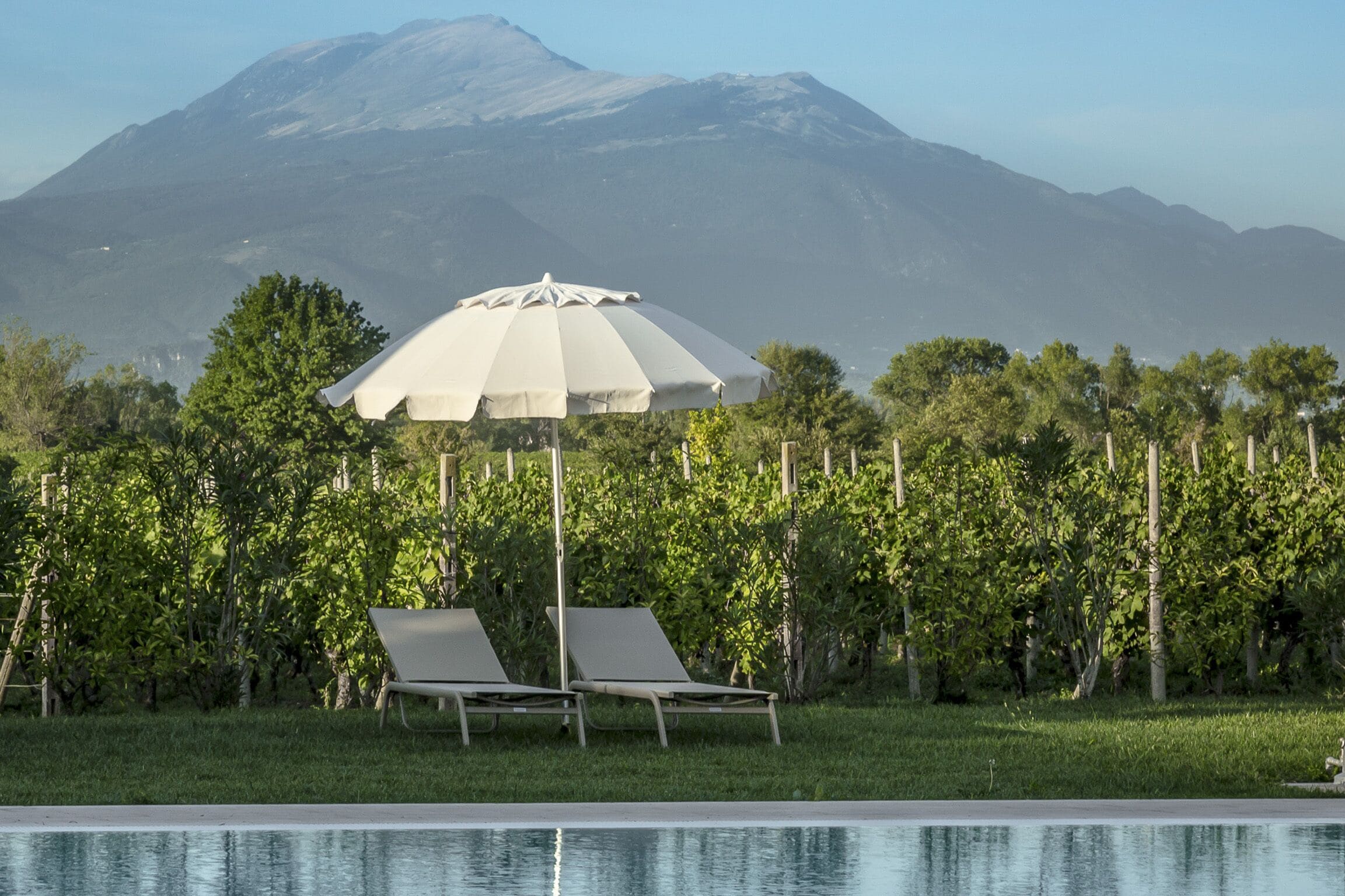 Seasonal outdoor pool, open 9:00 AM to 7:30 PM, pool umbrellas