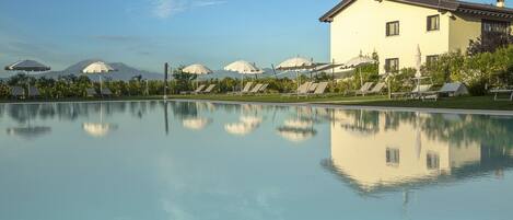 Seasonal outdoor pool, open 9:00 AM to 7:30 PM, pool umbrellas