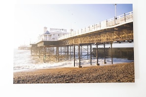 A pier with a lighthouse and a building labeled 'BRIGHTON PIER' extending into the sea. - Modern 1BDR Retreat | Near Queens Park & Seafront (Brighton and Hove)
