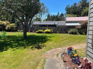 Property grounds - This house is a 3 bedroom(s), 2 bathrooms, located in Coos Bay, OR. (Coos Bay)
