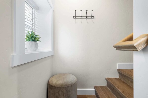 A staircase with wooden steps and a white wall. - Cozy 1BR Boise Retreat | Central Location (Boise)