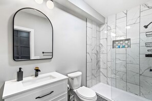 Shower, hair dryer, towels, soap - Modern 2-Bedroom Gem in Charming Downtown Providence (Providence)