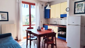 Apartment, 2 Bedrooms, Balcony, City View | Dining room - Bright Apartment With Pool (Cavallino-Treporti)