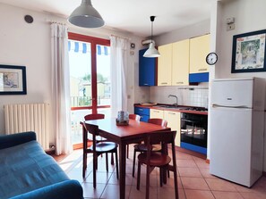 Apartment, 2 Bedrooms, Balcony, City View | Dining room - Bright Apartment With Pool (Cavallino-Treporti)