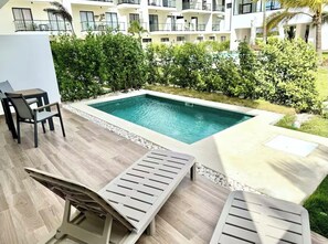 Outdoor pool - 2-bedroom apartment in Downtown Punta Cana with private pool , AC and gym access (Punta Cana)