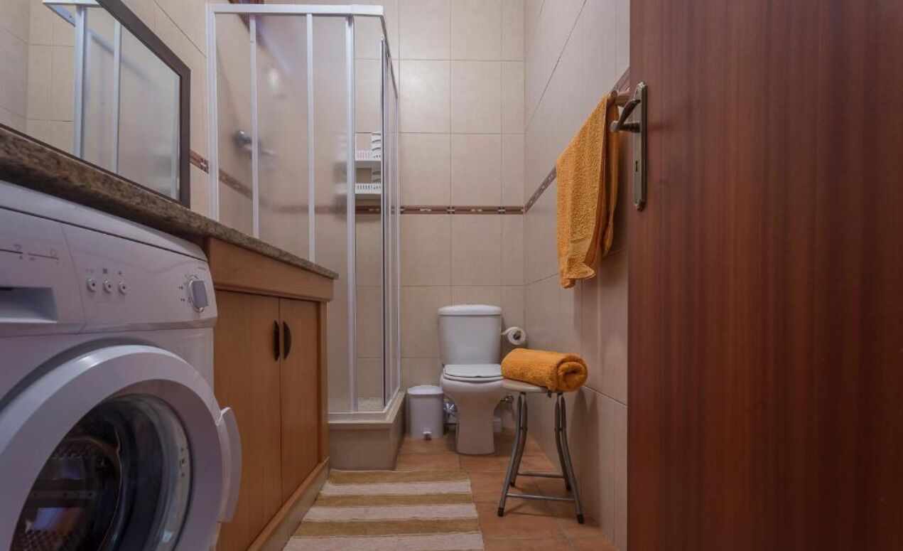 Shower, hair dryer, towels, toilet paper