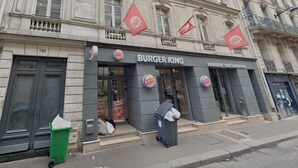 A Burger King restaurant with a classic facade, large windows, and a prominent Burger King sign. - HOTEL BOETIE - CHAMPS ELYSEES  (Paris)