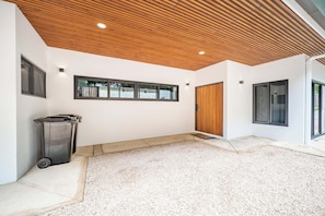 A modern interior with a wooden ceiling, a large window, and a door. - CASA LOLA a Modern Home in Pinilla, 3 master Bedroom and a private pool (Pinilla)