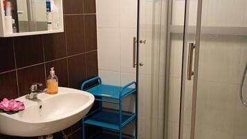 Shower, towels, soap, toilet paper