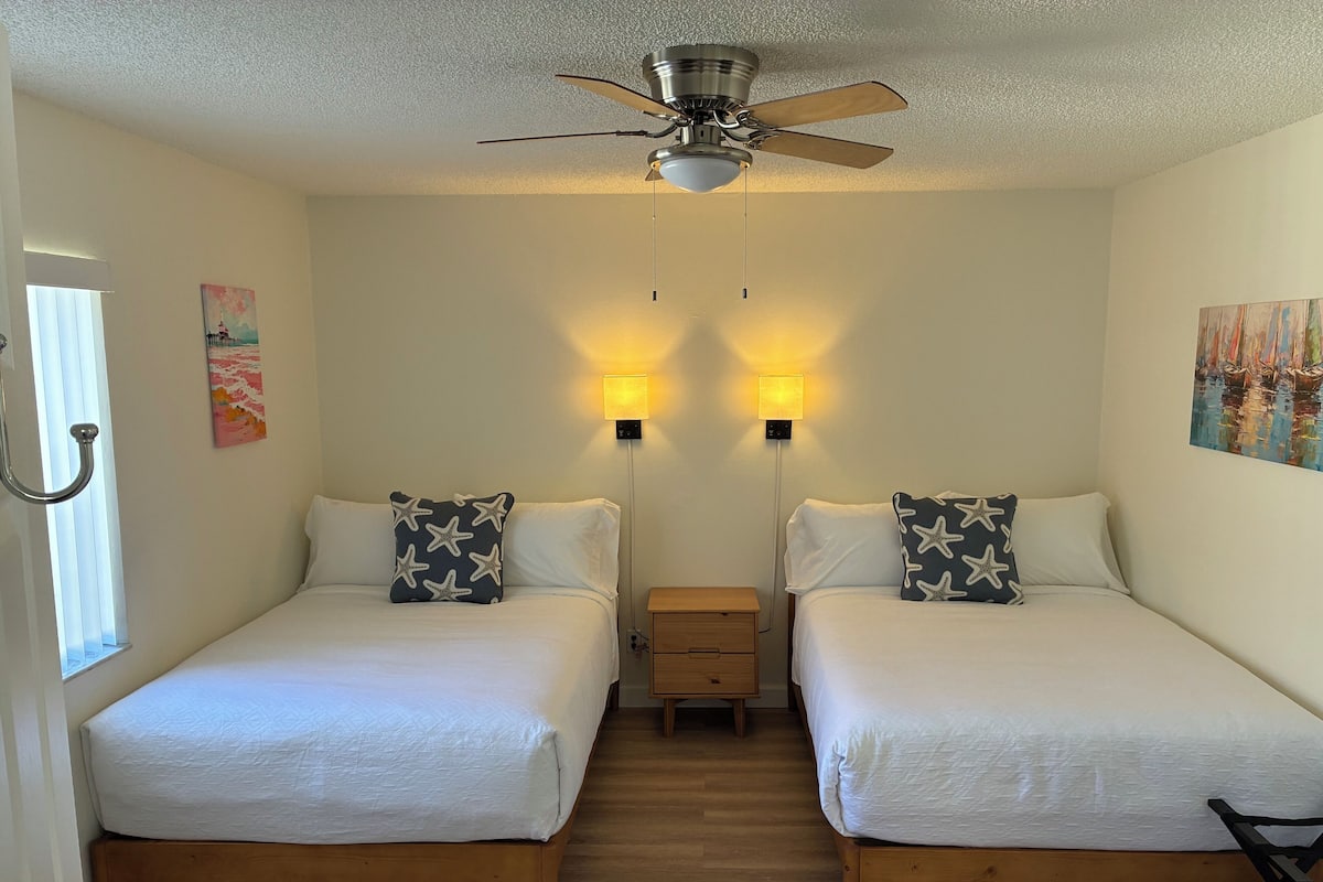 Laptop workspace, iron/ironing board, cots/infant beds, bed sheets