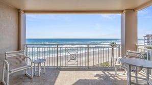 A balcony with a view of the beach and ocean. - Sandpiper 611 (New Smyrna Beach)