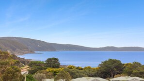 A coastal landscape with a clear view of the sea, rolling hills, and dense greenery. - Teremoana - the heart of Lorne (Lorne)