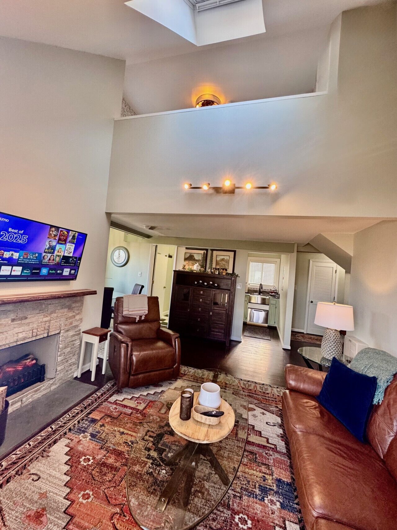 TV, fireplace, books, music library