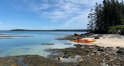 Serene 3-bed cottage in the Midcoast Maine woods, perfect for a quiet getaway.