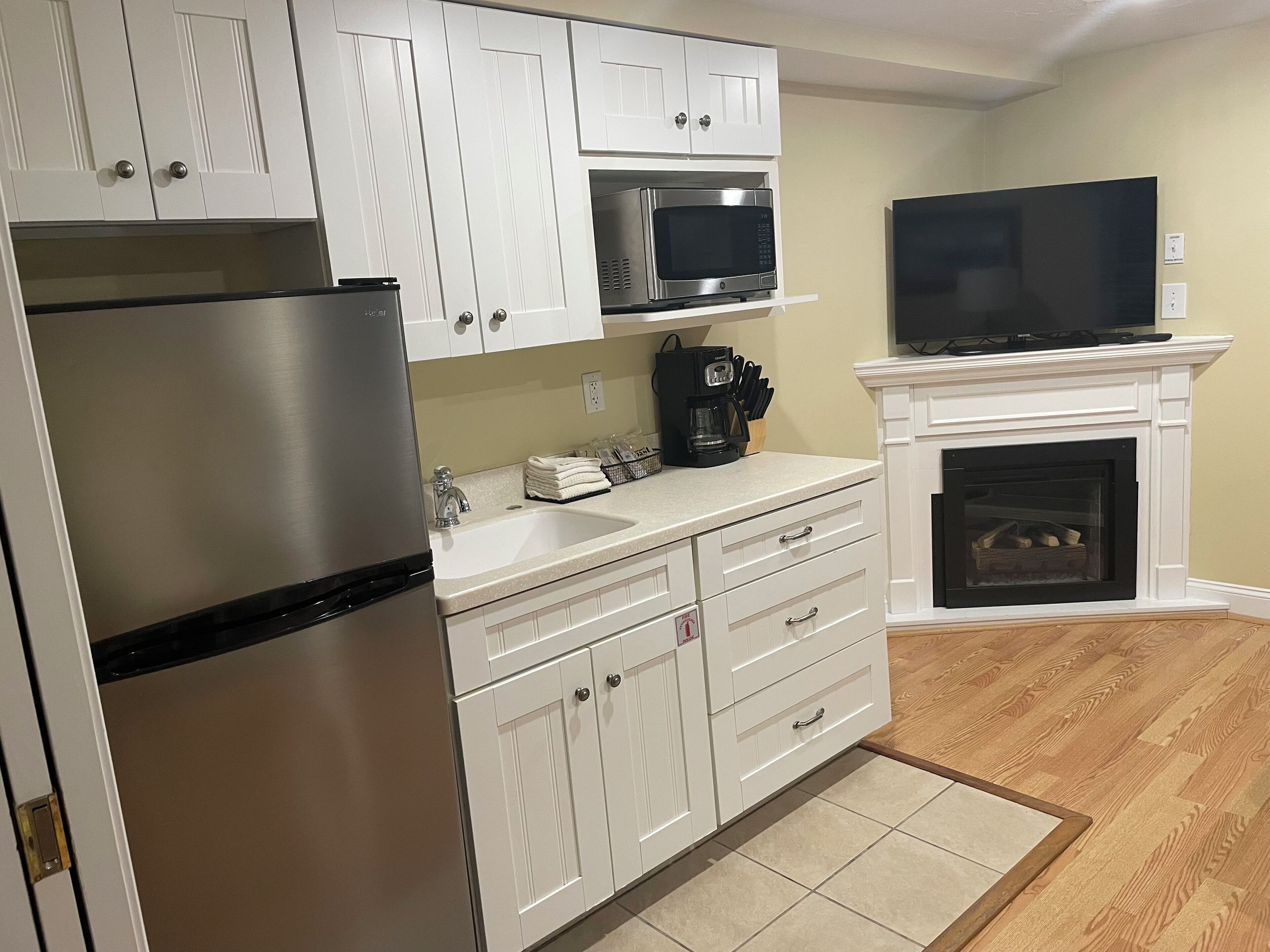 Microwave, paper towels, dining tables