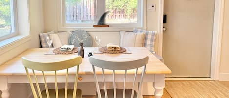 Enjoy home-cooked meals on the large solid wood dining table.