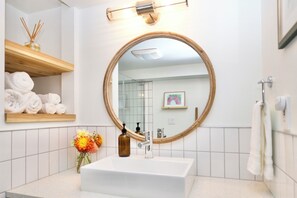 Shower, hair dryer, towels, soap