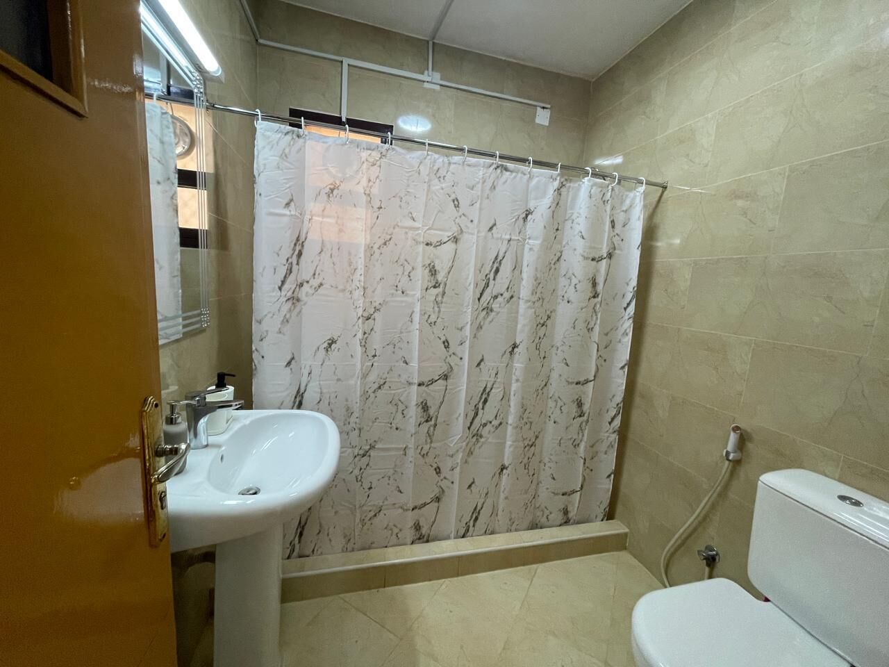 Shower, towels, soap, toilet paper