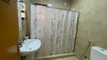 Shower, towels, soap, toilet paper