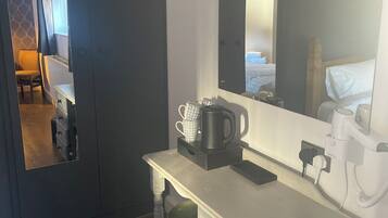 Deluxe Quadruple Room, Courtyard View | Desk, blackout drapes, iron/ironing board, free WiFi