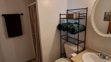 Shower, towels, soap, toilet paper