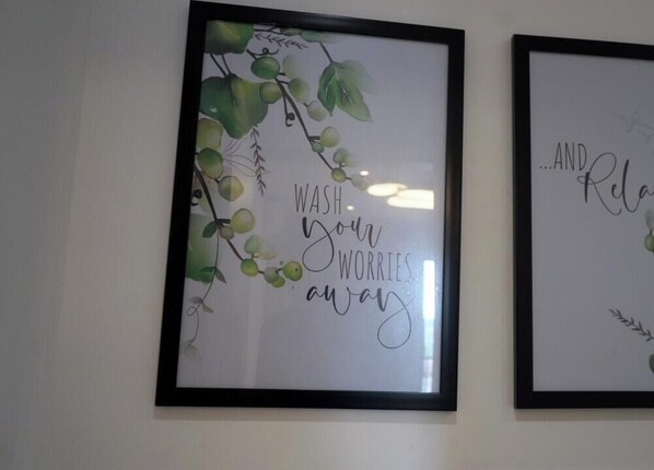 Two framed wall art pieces with text and greenery. - Loxwood House by Cozy (Accra)