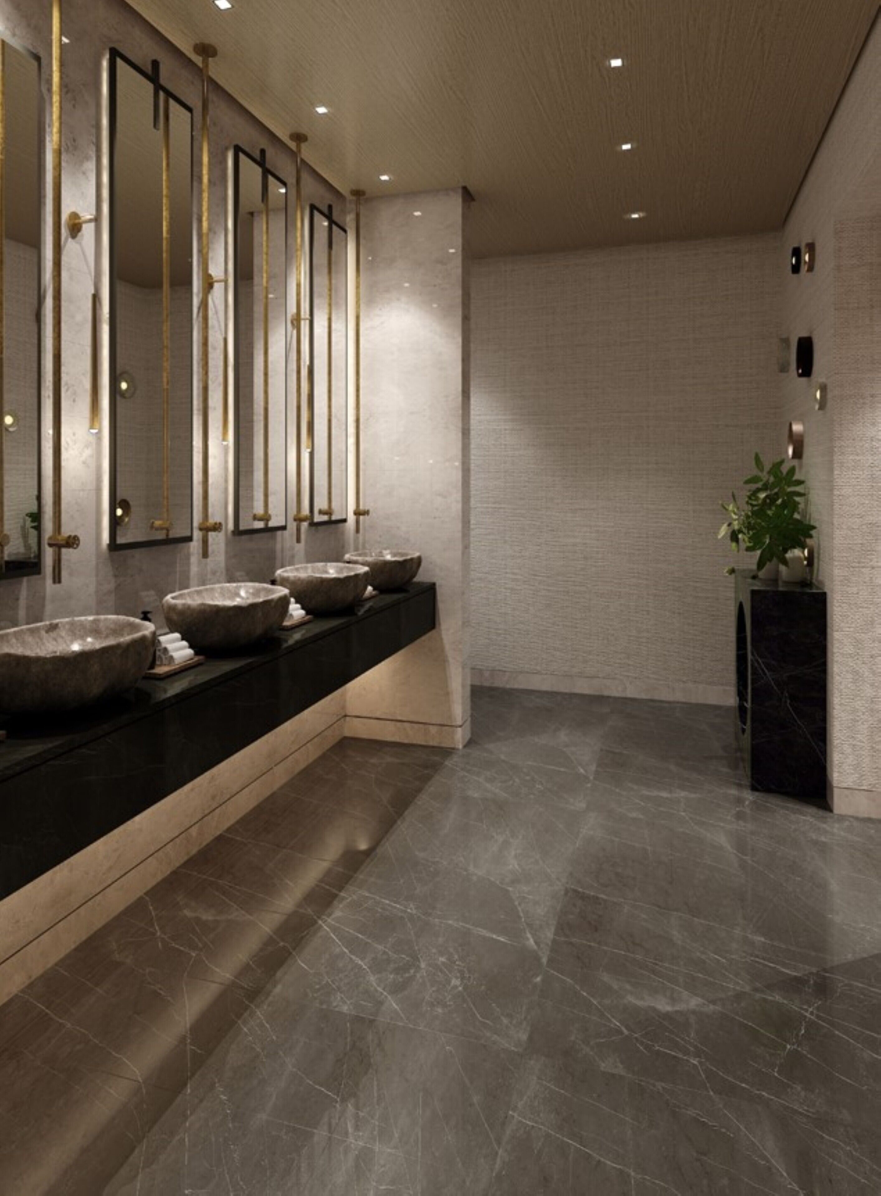 A modern bathroom with a long vanity, multiple sinks, and a large mirror.