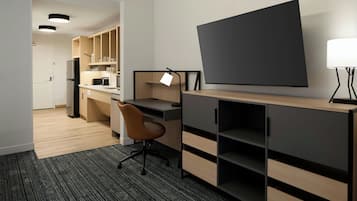 Studio Suite, 1 King Bed with Sofa bed | Living area | 55-inch Smart TV with cable channels